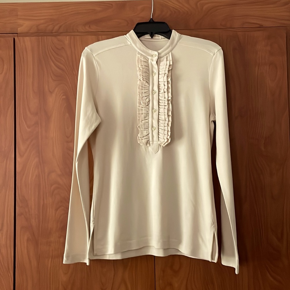 Classic Tory Burch ruffle front long sleeve knit top.